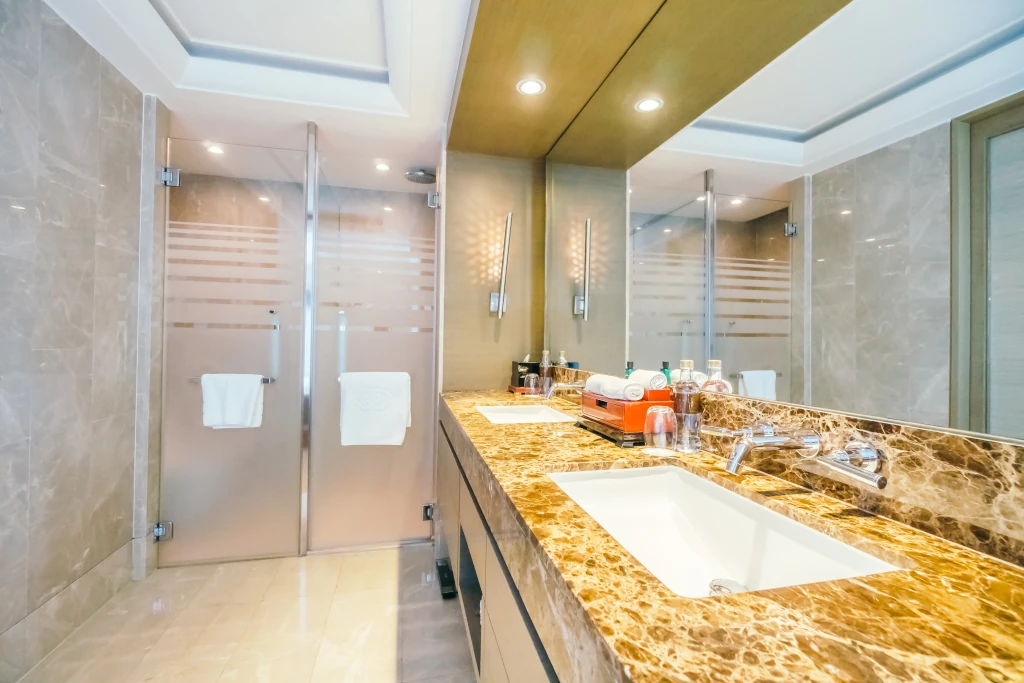 Luxury bathroom renovation with marble countertop and double vanity in Main Line home