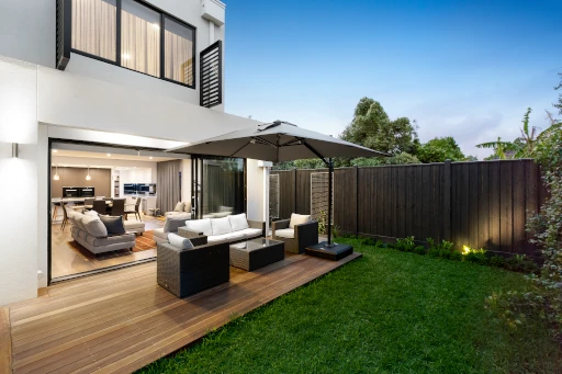 main-line-modern-patio-lounge-design Modern minimalist interior with wood finishes and houseplants, part of Main Line property maintenance services